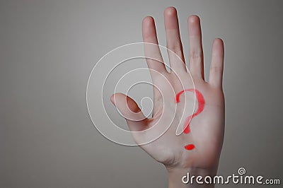 Red Question Mark on a Hand Stock Photo