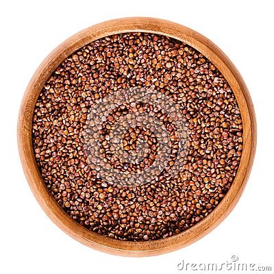 Red quinoa seeds in wooden bowl over white Stock Photo