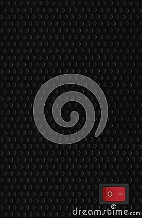 Red rectangle rocker power switch in on position, black abstract dot texture frame pattern, natural blank empty copy space Stock Photo