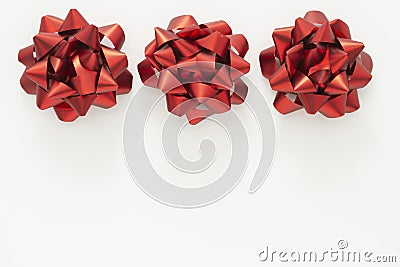 Red ribbon bows over white background. Birthday, Christmas or Valentine's day mock up frame or border Stock Photo