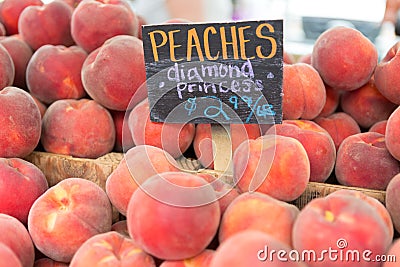 Red ripe peaches at the farmers market Stock Photo