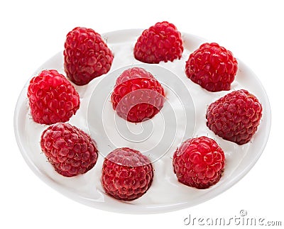 Red ripe raspberry fruit in small round plate Stock Photo