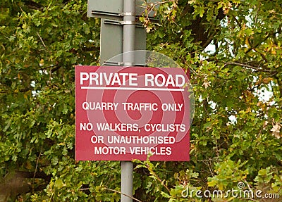 Red road sign post private road quarry traffic only Stock Photo