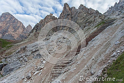 Red rocks, blocks and debris at the foots of dolomitic wall Stock Photo
