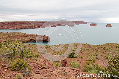 Red rocks in the blue lake water Stock Photo