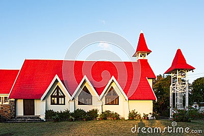 Red-roofed church Notre Dame Auxiliatrice at Cap Malheureux, Riviere du Rempart district, Mauritius Stock Photo