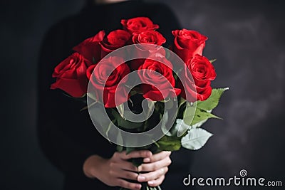 red rose bouquet being presented to special person, with romantic and sweet gesture Stock Photo