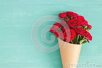 Red rose bouquet wrapped vintage craft paper Stock Photo