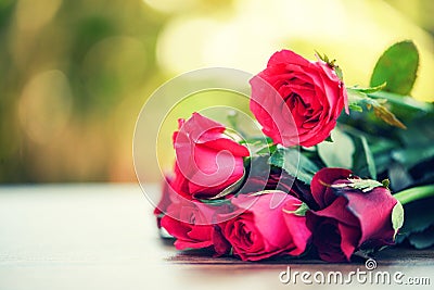 Red rose flower bouquet / Pink and red roses Valentines day love on wooden table nature Stock Photo