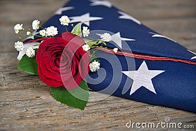 Red rose in folded flag Stock Photo