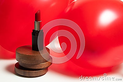 Red rose lipstick fashion beauty skincare with balloon decor Stock Photo