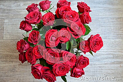 Red roses bouquet on grey background, top view Stock Photo