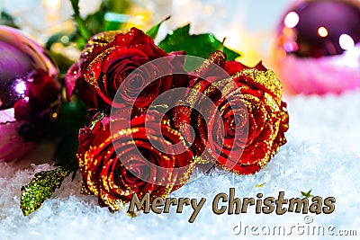 Red roses with glitte in snow and christmas balls Stock Photo