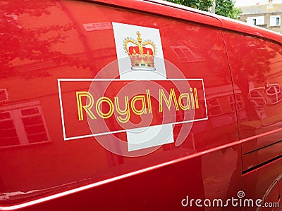 A red Royal Mail deliver van, logo sign. London, UK. Editorial Stock Photo