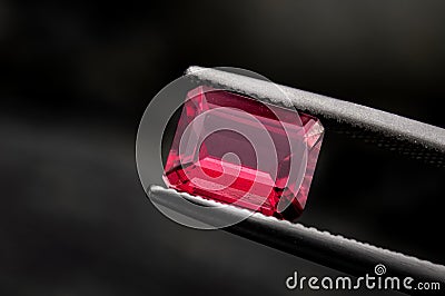 Red ruby gemstone with dark rock Stock Photo