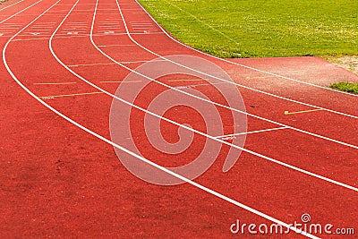 Red running track in stadium. Stock Photo