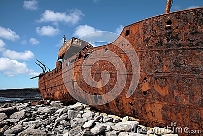 Red rust on old sank boat in Inisheer, Aran Islands Stock Photo