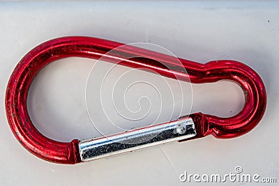 Red rusted used old karabiner close up detail Stock Photo