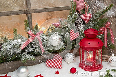 Red rustic christmas decoration on window sill with red checked Stock Photo