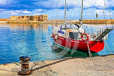 Red sailing boat in old town of Chania, Crete island, Greece Stock Photo