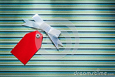 Red sale tag on striped fabric shopping concept Stock Photo