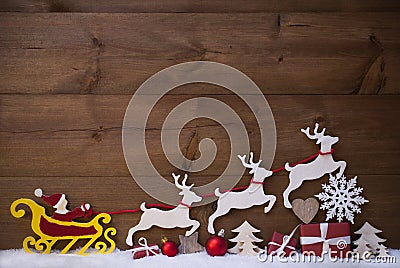 Red Santa Claus Sled With Reindeer, Snow, Christmas Decoration Stock Photo