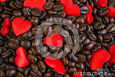 Red satin hearts on coffee beans, valentines or mothers day background, love celebrating Stock Photo