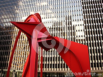 Red sculpture in front of modern building Editorial Stock Photo