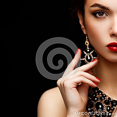 Red Lips and Nails closeup. Manicure and Makeup. Make up concept. Half of Beauty model girl's face on Stock Photo