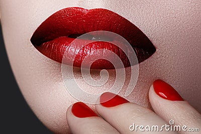 Red Lips and Nails closeup. Open Mouth. Manicure and Makeup Stock Photo