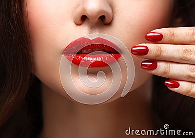 Red Lips and Nails closeup. Open Mouth Stock Photo