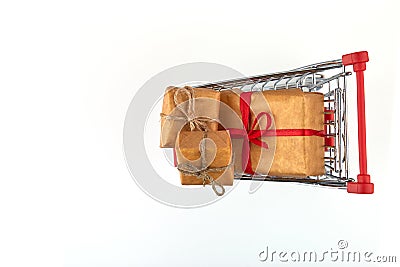 Red shopping cart with three presents boxes from above Stock Photo