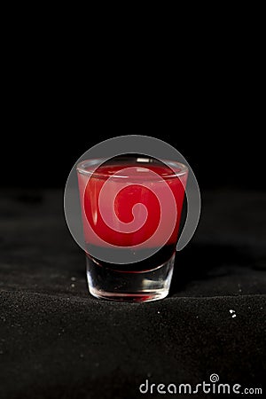 Red shot cocktail with jagermeister, cranberry juice and schnapps Stock Photo