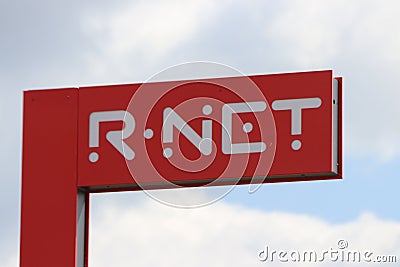 Red sign of the R-NET transport system at the trainstation of Gouda. Editorial Stock Photo