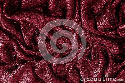 Red silk fabric. Texture, background, pattern. It has a fine luster with small color variations to give the appearance of slabs i Stock Photo