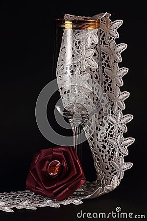 Red silk rose and glass Stock Photo