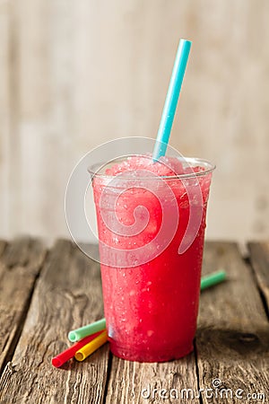 Red Slushie Drink in Plastic Cup with Straws Stock Photo