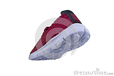 Red sneaker on a white sole. Stock Photo