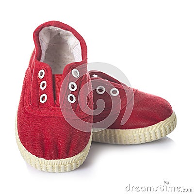 Red sneakers shoes for kids isolated on white background Stock Photo