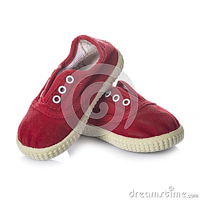 Red sneakers shoes for kids isolated on white background Stock Photo