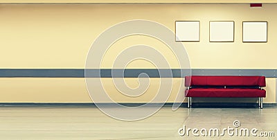 Style minimalism. Red Sofa, interior design, office. Empty waiting room with a modern red sofa in front of the door and three empt Stock Photo