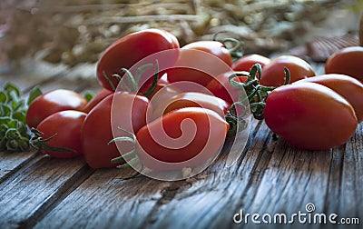 The Red Soft Red Cheery Tomatos On The Wood Table. Close Up Stock Photo