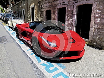 Red sport car in the ancient city Editorial Stock Photo