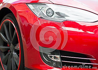 Red sports car headlight. Stock Photo