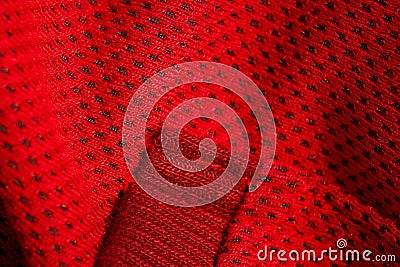 Red sportswear closeup top view. seam and juncture. breathable knitwear. clothing details macro Stock Photo