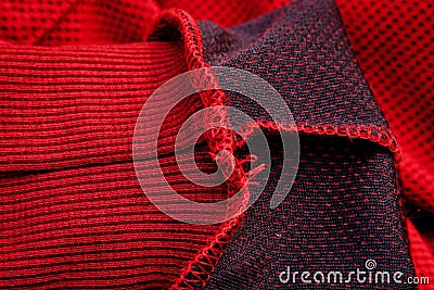 Red sportswear closeup top view. seam and juncture inside out. breathable knitwear. clothing details macro Stock Photo