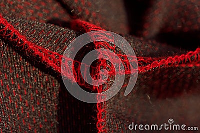 Red sportswear closeup top view. seam and juncture inside out. breathable knitwear. clothing details macro Stock Photo