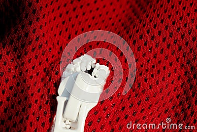 Red sportswear closeup top view. white zip line. breathable knitwear. clothing details macro Stock Photo