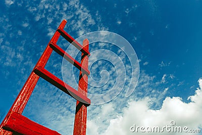 Red wooden staircase against the blue sky. Development Motivation Business Career Heaven Growth Concept Stock Photo