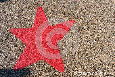 Red star on a anti-trauma carpet for child in a italian playgrou Stock Photo